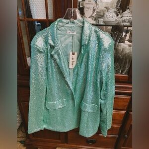 Sequin aqua color blazer with tags! Never worn size large.